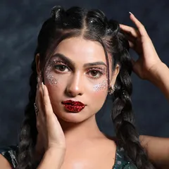 A bold and edgy look perfect for a photoshoot or a music festival. I used chunky glitter on the eyes and a deep, glittery red lip to make a powerful statement.