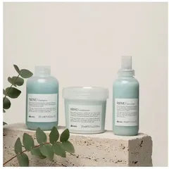 The Davines MINU line, including a shampoo, conditioner, and hair serum, is specifically designed to protect and illuminate colored hair, keeping it vibrant for longer.