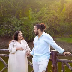 A happy, relaxed portrait of the couple holding hands during their outdoor maternity session. Their comfortable and natural interaction is exactly what we aim to capture in our photography.