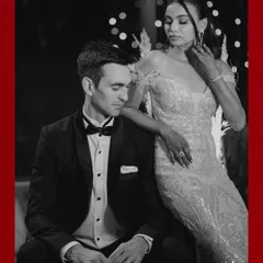 A timeless black and white portrait of the couple, looking elegant and poised during their glamorous cocktail event.