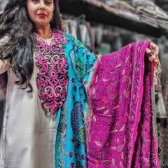 Here I am showcasing how you can pair a vibrant, two-tone embroidered dupatta and a matching neckpiece with a simple white kurta. These pieces can be purchased separately and are a great way to add a pop of color and elegance to your look.