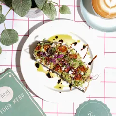 A classic overhead shot is perfect for showcasing cafe dishes like this avocado toast. I focus on bright, natural lighting and careful composition with menu branding to create a clean, appetizing image that’s ideal for menus and Instagram feeds.