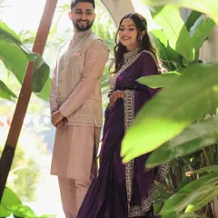 A candid moment captured between Devanshi and Anshul before their ceremony. Framed by lush greenery, this photo shows a quiet, stolen moment of connection away from the crowds.