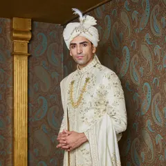 A closer look at the fine embroidery and the jeweled sarpech on the safa. These are the details that transform a garment into a cherished heirloom.