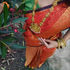 A perfect drape on my beautiful friend. This shot captures the elegance of a well-draped Kanchipuram silk saree, with every pleat in place.