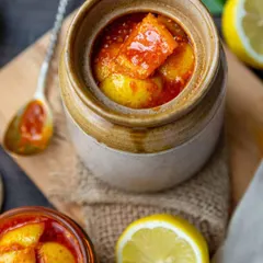 A close-up of our tangy and spicy Nimbu ka Achaar. You can see the rich texture and the perfect blend of spices that my mom uses. This is the perfect pickle to aid digestion and add a kick to any meal.