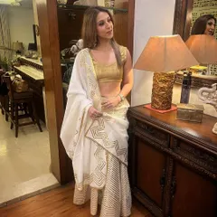 Another look at my white and gold saree. The metallic blouse adds a touch of glamour to the elegant ensemble.