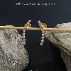 Effortless charm in every detail. These curved diamond bar earrings sparkle just enough to catch the light and tell your story, proving that simplicity is the ultimate sophistication.