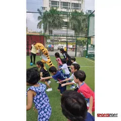 A group of kids enjoying a football-themed birthday party I organized. I create a fun and safe environment for children to celebrate their special day with their friends on the field.