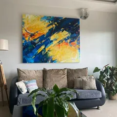This abstract piece, 'Confluence', found its perfect home. It shows how a bespoke abstract can completely define a living room's atmosphere. We can work with your color palette and style to create a piece that feels like it was always meant to be there.