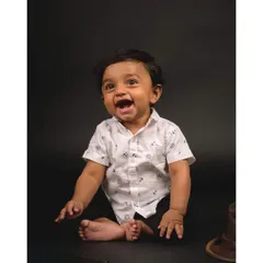 A candid shot of a baby laughing during a studio session. My approach is to create a fun environment where children can be themselves.