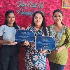 We offer combo courses for students who want to master both nail and lash artistry. Here's a happy group of students who have just received their certifications.