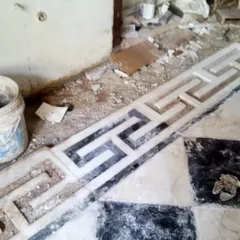 During the restoration process, we carefully uncovered and repaired the original marble flooring, including the intricate Greek key border. This detail work is crucial for preserving the authentic character of a heritage building.