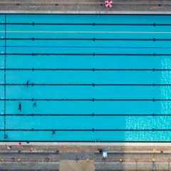 An aerial view of our swimming centre reveals the impressive scale and design of our pools. These shots showcase our clean, organized, and spacious environment, perfect for both training and leisure.