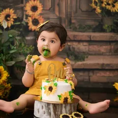 This sunflower-themed cake smash is full of sunshine and smiles. We coordinate the cake, outfit, and backdrop for a perfectly cohesive and joyful first birthday shoot.