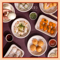 Planning a get-together? This is what a Kaleido feast looks like. A vibrant spread of assorted dim sum, including steamed gyoza, fluffy bao, and crispy fried wontons, all delivered fresh for your party.