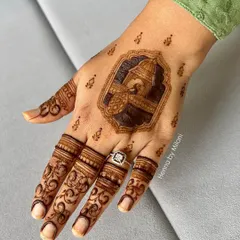 A closer look at the groom's portrait mehendi. The details are kept simple and clean, perfect for a groom who wants something special but not too heavy.