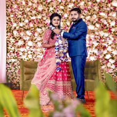A classic wedding reception with a beautiful floral wall backdrop. We created this dense wall of flowers to serve as an elegant and timeless setting for the couple's reception photos.