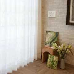 A quiet corner brought to life with my custom hand-painted wall art. This image shows two canvases with nature scenes, demonstrating how art can be displayed in unconventional ways to add color and inspiration to small spaces.