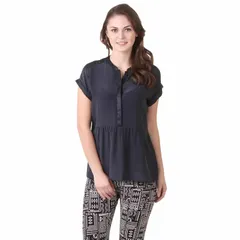 A standard catalog shot of a model in a casual black top and patterned leggings, showcasing a typical look for online retail.