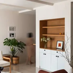 Another view of the living room in Chakma's Home, showcasing our minimalist approach to interior design. The focus is on light, space, and a few carefully selected pieces of furniture and art.