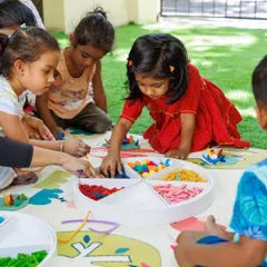 A glimpse into our group activities where children learn to share and create alongside one another. This colorful, multi-sensory setup encourages fine motor skill development as they pick, place, and sort different materials.