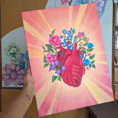 This piece, 'The Heart's Embrace,' is a deeply personal acrylic painting on canvas. It represents healing and growth, with flowers blooming from an anatomical heart.