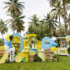 A bright and sunny lemonade-themed party, perfect for an outdoor celebration. This cheerful setup features a fresh color palette of yellow and blue, a lemonade stand prop, custom signage, and oversized lemon cutouts, making for a zesty and unique birthday experience.