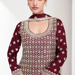 The heavy thread embroidery and sequins on this maroon Chinon silk top are what make it so special. It's all about that rich, luxurious detail.