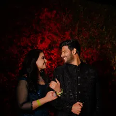 A simple yet powerful portrait using a red-lit background. We love playing with color and shadow to create moody and romantic couple portraits during evening events.