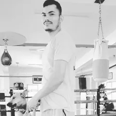 A black and white photo from the boxing gym with a furry friend. A balanced life is important, and I enjoy every moment.