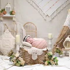 A rustic teepee setup with soft, neutral tones. We use a variety of props like lanterns, candles, and floral arrangements to build a cozy and inviting scene.