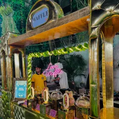 The golden waffle counter, a luxurious setup designed to impress guests and satisfy their sweet cravings.