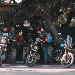 Here, I captured a group of riders from the Royal Enfield meet up discussing their bikes. These unposed moments are crucial for creating authentic visual content that resonates with the community.