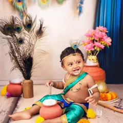 Caught in the act! A mischievous Kanha with a little butter on his face, adding a playful and authentic touch to our Janmashtami photoshoot.