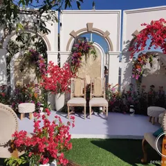 The full ceremony setup on the couple's home terrace. We used architectural arches and an explosion of colorful flowers, including their favorite bougainvillea, to create a stunning and personal mandap.