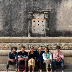 The talented young photographers from our Our Shared Cultural Heritage (OSCH) program, sitting together at the 1000-year-old Ramalingeshwara temple during a field trip.