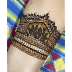 A beautiful arm band design featuring a bold lotus flower. The lotus is a symbol of purity and beauty, and it adds a touch of serenity to any mehndi design.