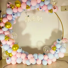A close-up of the pink and blue balloon arch for the gender reveal party.