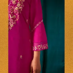 A closer look at the sleeve of my magenta kurta. I pay close attention to details like the delicate floral embroidery on the bell sleeves and the organza panel.