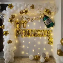 A beautiful birthday backdrop for your princess. This setup features a wall of fairy lights, a white and gold balloon arch, and "MY PRINCESS" foil letters for a truly special and personalized touch.