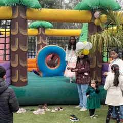 Kids enjoying the spacious jungle bouncy castle at an outdoor birthday party. I handle the complete setup and takedown, so you can focus on the event.