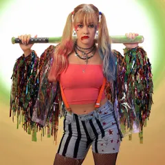A full-shot of a model in a creative Harley Quinn cosplay, holding a baseball bat against a stylized background. This showcases my ability to execute fun and detailed character-based photoshoots.