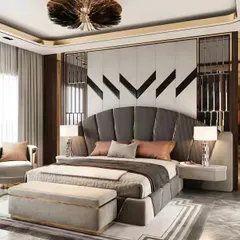 This bedroom exudes art deco glamour with a fan-shaped upholstered headboard and metallic accents. The design is bold and luxurious, perfect for a statement master suite.