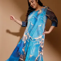 I love working with bold, abstract patterns like the one on this blue marble-print dress. It’s a statement piece designed for a flowy, comfortable fit, proving that plus-size fashion can be both artistic and easy to wear.