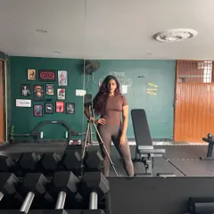 Just me, posing and flexing in my favorite place. This gym is my sanctuary, the place where I build my own strength and find my focus.