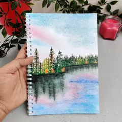 The third design in my notebook series features a serene forest and lake scene. All my notebooks are A5 size with metal wiro binding and 75 GSM paper.