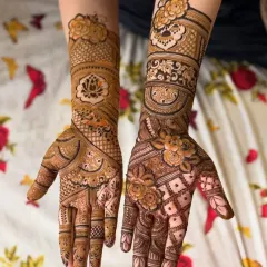 This design shows a mix of styles, with one hand featuring a lotus centerpiece and the other a dense floral and jaal pattern, showcasing my versatility.