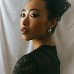 A classic portrait with an elegant updo. This type of headshot showcases the model's bone structure and versatility for more sophisticated roles or campaigns.