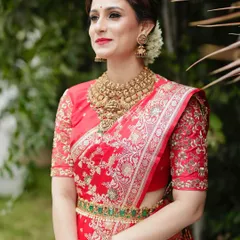 A beautiful portrait showcasing the rich texture of the Banarasi silk and the craftsmanship of the hand-embroidered blouse.